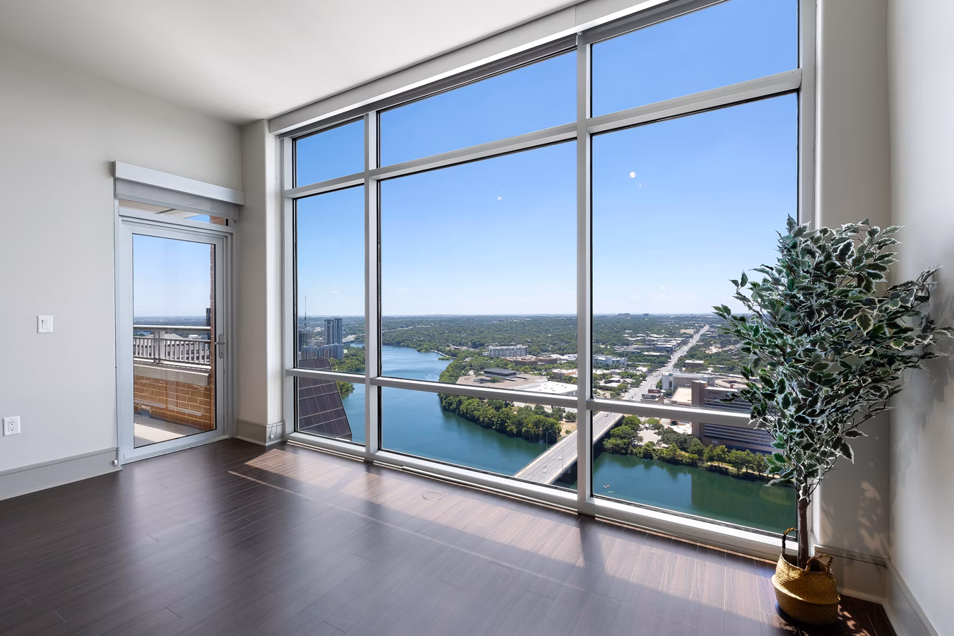 Spacious outdoor patio at Ashton Austin Apartments with modern seating and scenic city views